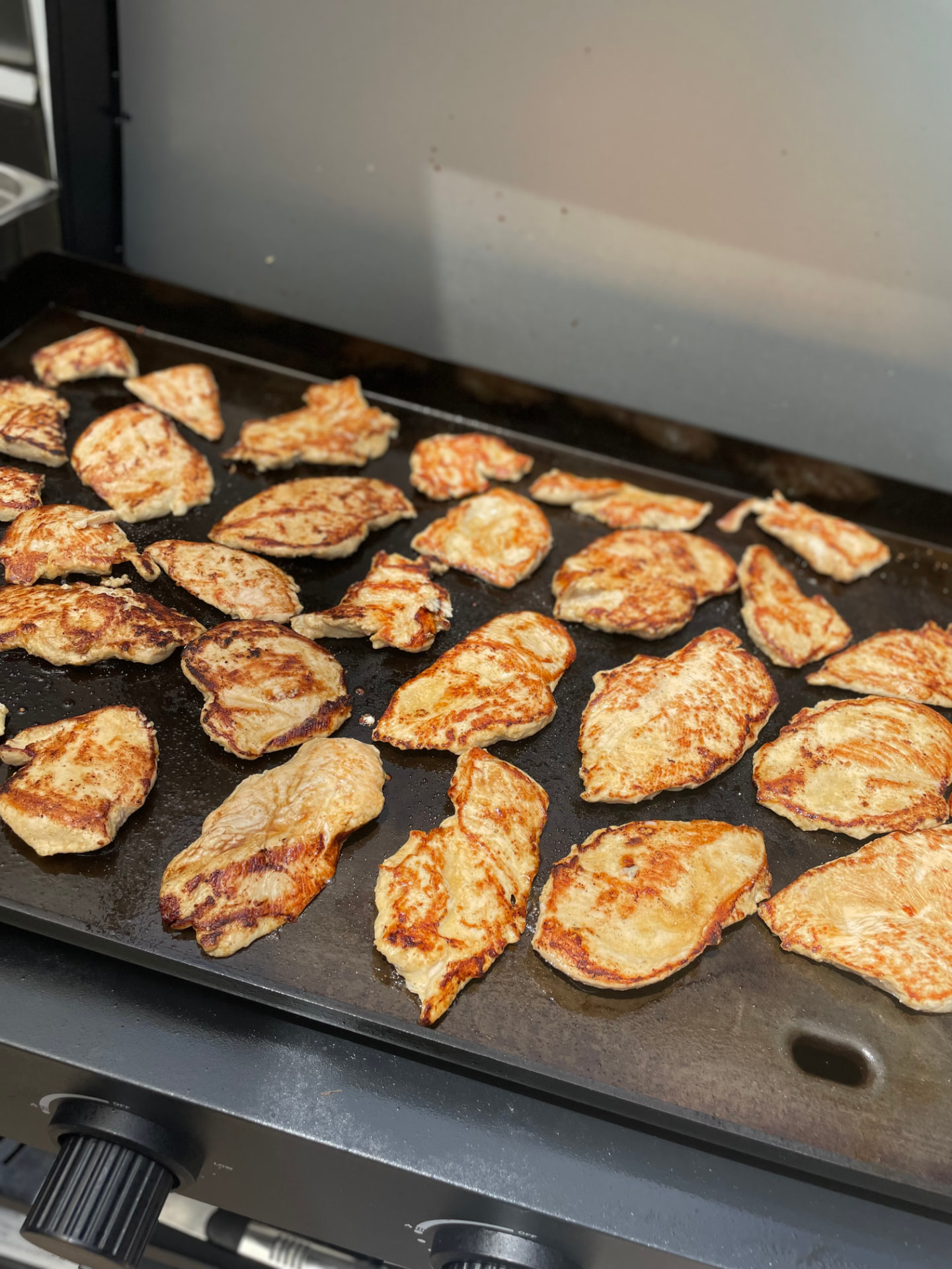 Fresh grilled chicken breast on the griddle